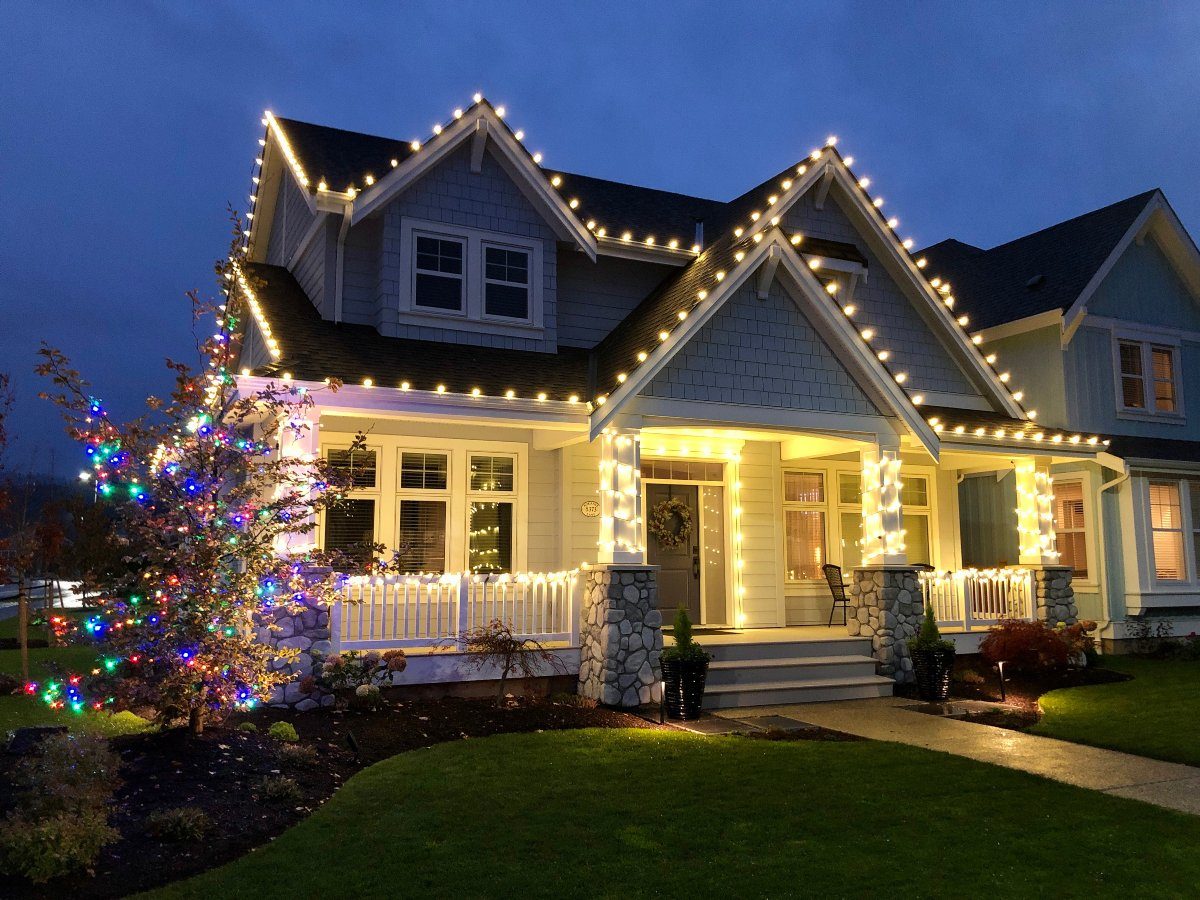 Warm white Christmas lights on Hickory NC home exterior