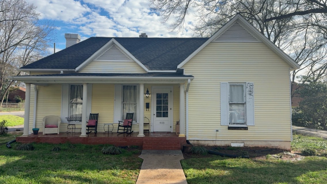 House after soft washing — clean siding, same home Hickory NC