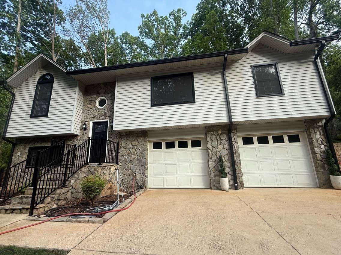 House soft washing Hickory NC — HydroClean team removing algae from vinyl siding